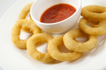 Appetizing Thick Cut Onion Rings isolated on white background