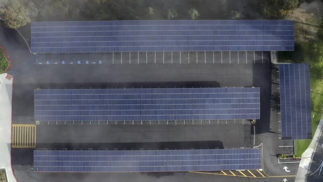 Rising birds eye aerial view, solar panels, morning fog clouds, Los Angeles, California