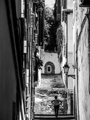 Narrow street with stairs in the Granada neighborhood of Albaicín, a World Heritage Site