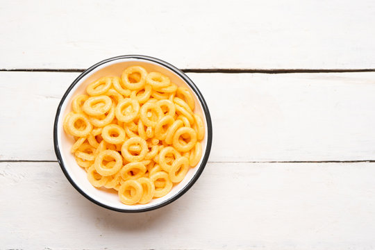 Rings of fried wheat is a mexican snack on white background