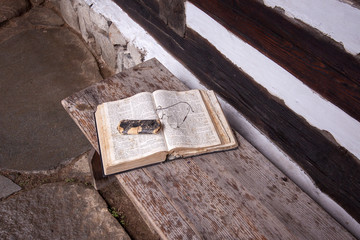 Old book on wooden table