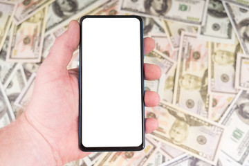 Mobile phone in hand on a background of money. A clean white Mock up screen for design and simulation. Business concept, dollar exchange rate, sales growth. tax