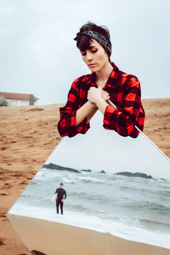 Sad Woman With Big Mirror Standing On Beach