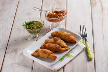 panzerotti filled with red pesto and basil pesto sauce