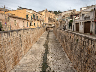 Fototapeta na wymiar Scicli cityscape. View to Historical Buildings. Sicily, Italy.
