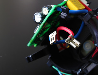 electronic circuit components on a black background
