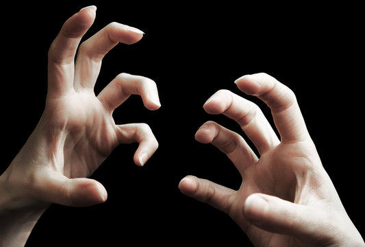 Scary two hands gesture isolated on black