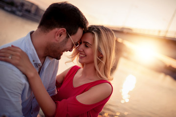 Loving couple by the river.