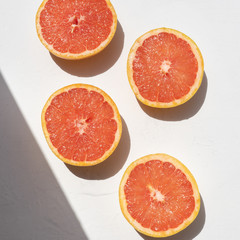 Grapefruit rich in vitamin c on white background