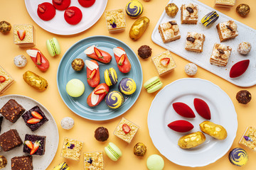 Various yummy desserts on plates