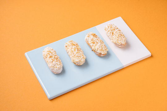 Sweet eclairs with white frosting