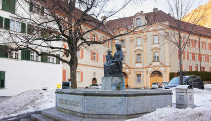 Fototapeta premium Monument near Cathedral of the Assumption in Chur at sunrise