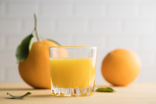 Orange Juice In Glass On The Table