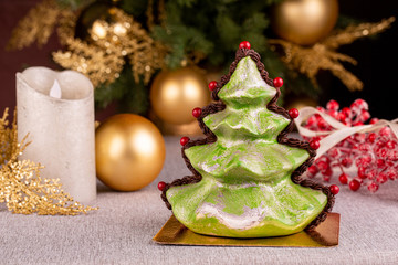 Chocolate tree with silver spray with red beads and Christmas tree toys