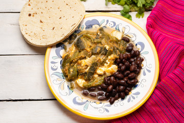 Mexican poblano pepper rajas and panela cheese on white background