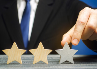 Critic points to third star. The concept of the rating of hotels and restaurants. The evaluation of...