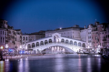 The Rialto Bridge over the Grand Canal in Venice, Italy at night