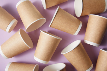 paper cups isolated on violet background