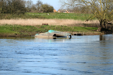 Small sunken boat in a river