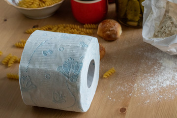 Still life toilet paper. There is no toilet paper and flour available. Flour and preserved foods, pandemic storage. Storage in the closet, Baked goods and cereals, Jar of pickles, Cookies