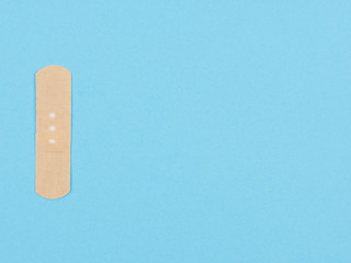 Band-aid on a blue background.