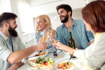 Friends having lunch together at home.