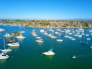 a stunning aerial shot of the blue ocean water and white boats and yachts in the harbor with a view...