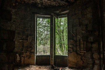 Fototapeta na wymiar Big window in the middle of old ruins