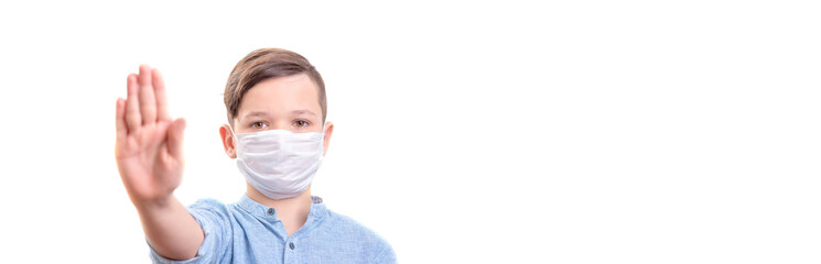 Handsome brunette boy in medicime mouth mask showed stop coronovirus banner. Stay home stay safe