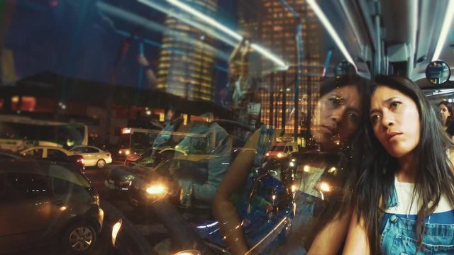 Hispanic woman on public transportation in a big city of latin america during the pandemic of the coronavirus. 4k	
