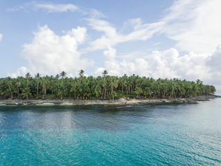 Fototapeta na wymiar Scenic aerial of tropical island rocky beach