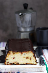 Lviv cheesecake, a traditional Ukrainian dessert with raisins, coated with chocolate icing.