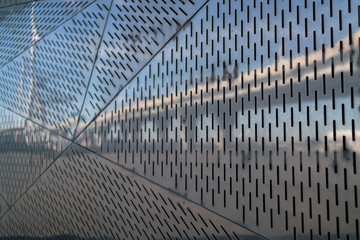 reflective metal plate with ventilation holes. In architectural forms plate triangles