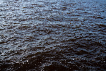 water with waves top view dark