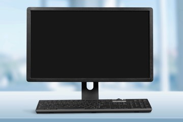 Modern desktop computer and keyboard on the desk