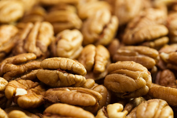 Pecan nuts background. Closeup pekan seeds