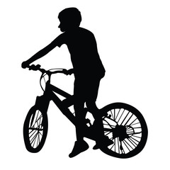 Fototapeta na wymiar a boy riding bicycle, silhouette vector 