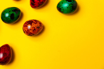 Easter card concept. Lot of easter eggs on a yellow background. Background with space to text