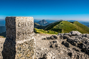 A view of the ridge of a Small Fatra, in the background  Velky Rozsutec, a view from Chleb, a stone with name of  the hill Chleb