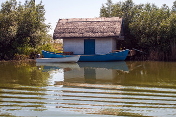Traditional house with thatched roof in the Danube delta, Romania. travel destination