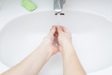 Woman washing hands with antibacterial soap sanitizer. Hygiene concept.