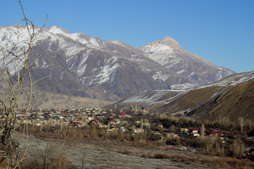 Mountain landscape in green valley with river. Beautiful landscape of the Caucasus mountains. Beautiful landscape of the Caucasus rocky mountains