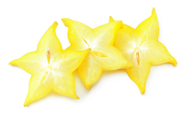 Fototapeta premium slice ripe star fruit carambola or star apple ( starfruit ) on white background. top view