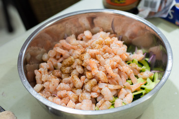 Delicious fresh seasoned shrimps and vegetables in a bowl