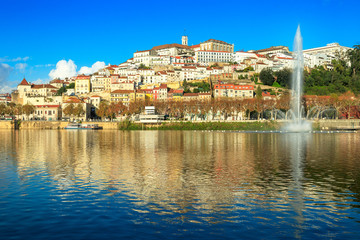 Cityscape of Coimbra, in Portugal, seen from the Mondego river with the fountain and in the...