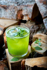 green cocktail with ice and Basil
