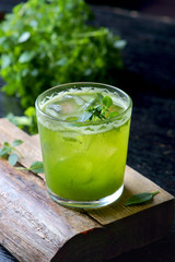 green cocktail with ice and Basil