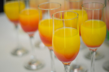beautiful luxury juice in a wine glass. Rich drink during presentation. Healthy drink in a glass of squeezed fruit