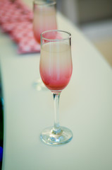 beautiful luxury juice in a wine glass. Rich drink during presentation. Healthy drink in a glass of squeezed fruit