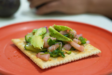 Delicious Mexican seafood toast made with shrimps and avocado